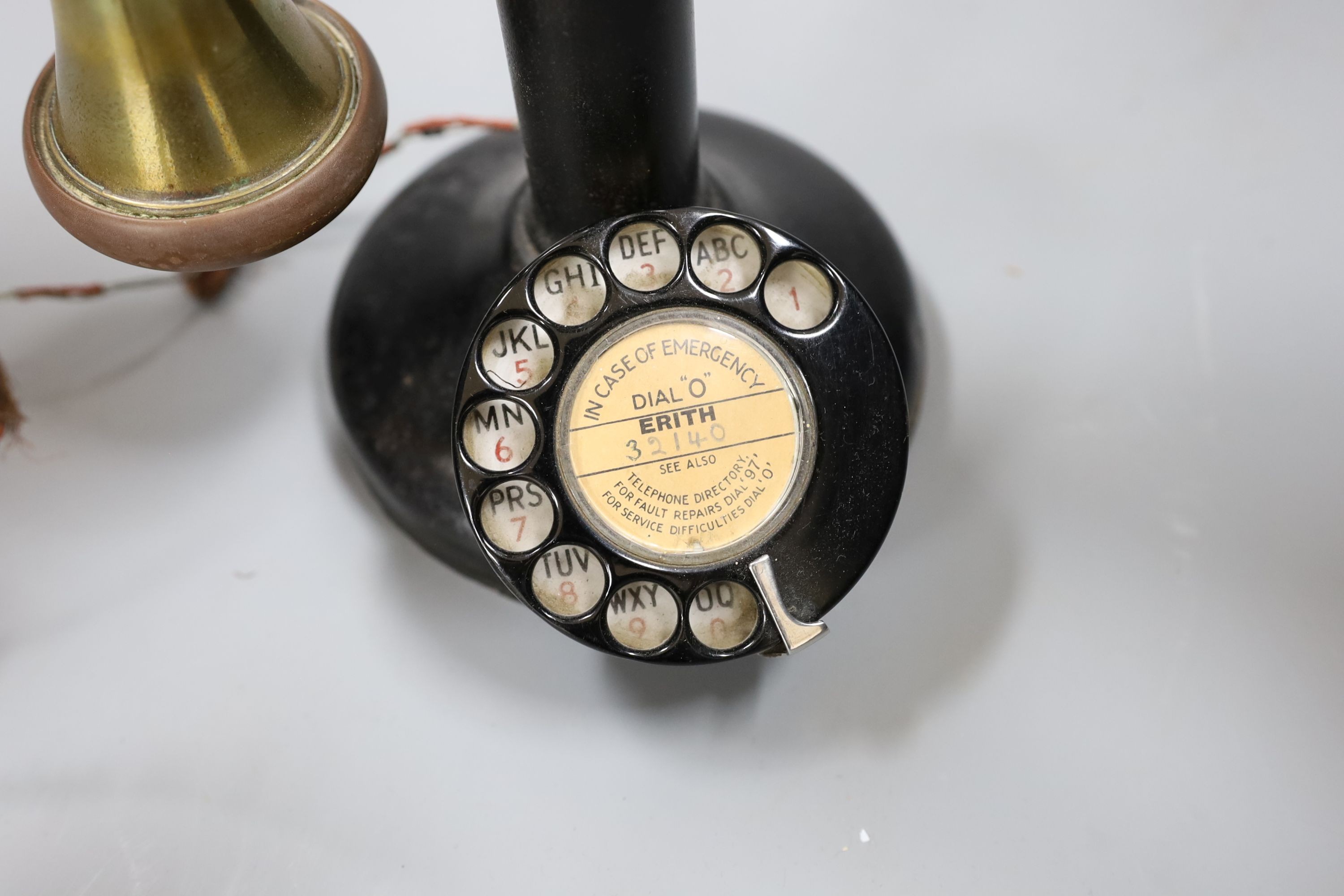 A brass mounted pillar telephone, 34cms high.